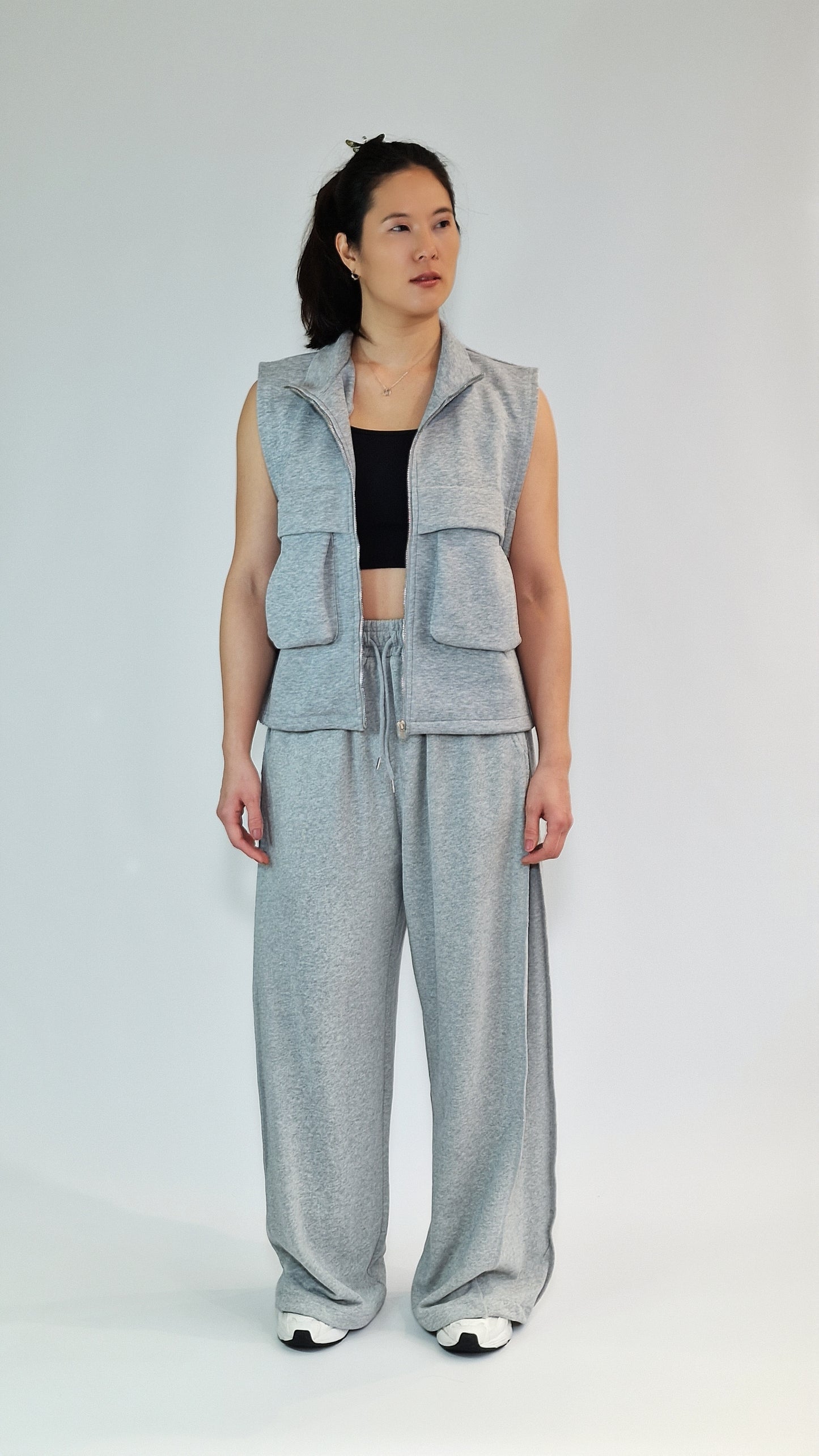 Calças de Perna Larga em Malha Fluida com Ajuste na Bainha